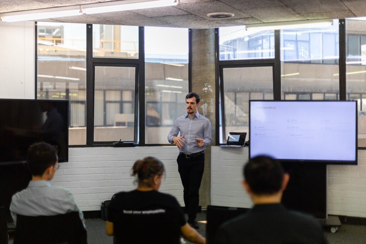 Alex Carpenter speaking at an event